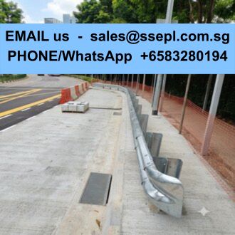 Blue banner with contact info over a construction site: 'EMAIL us - sales@ssepl.com.sg PHONE/WhatsApp +6583280194' above a concrete sidewalk with a metal railing and orange safety barriers.